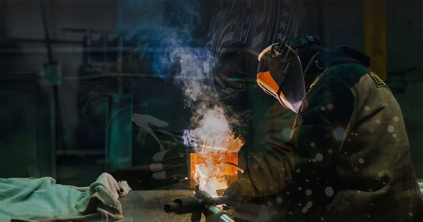 General contractor welder wearing safety gear while using welding equipment