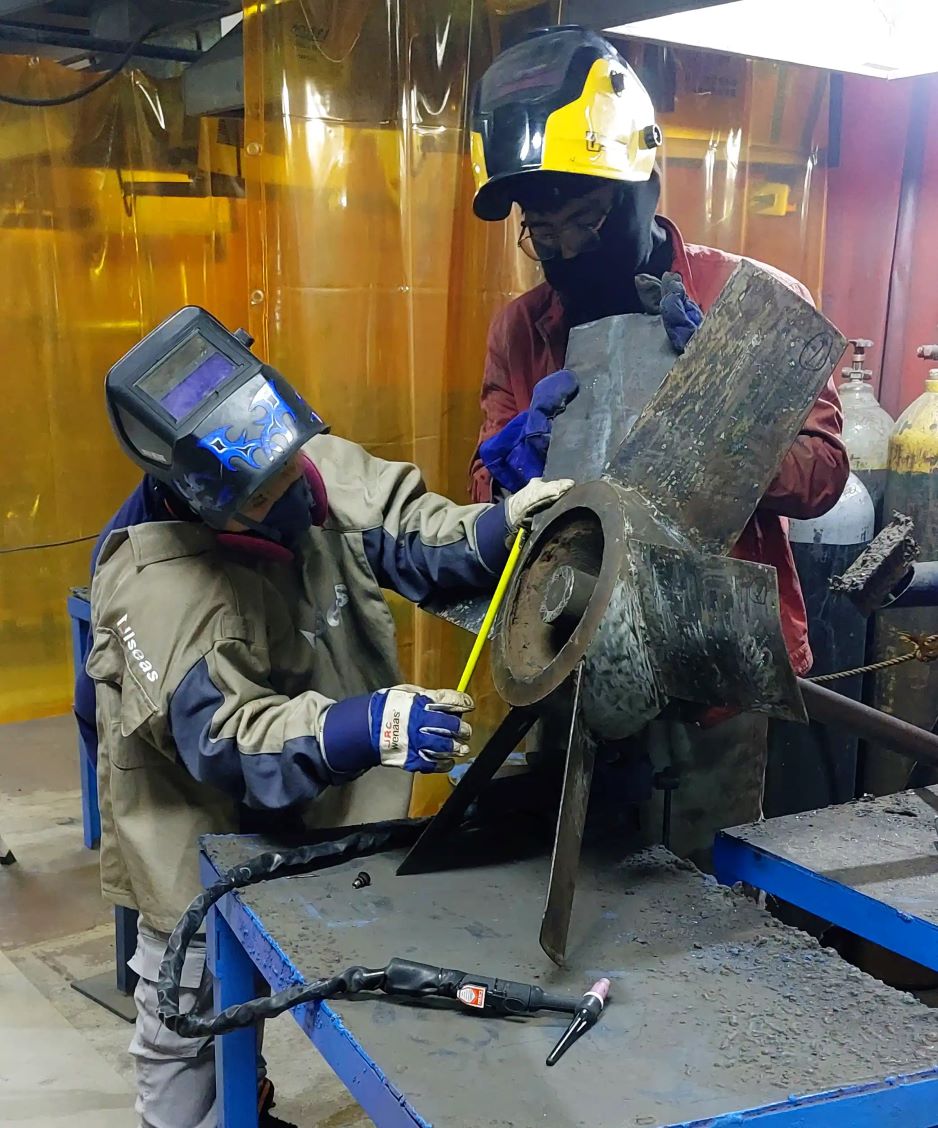 Two man working with repairs and rehabilitation of a product.